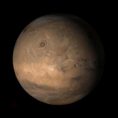 An Image from NASA showing the Tharsis face of Mars, a vast volcanic plateau centered near the equator in the western hemisphere of the planet.
