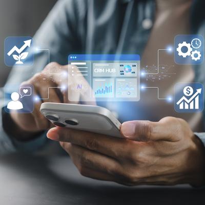 Person using smartphone illustration with CRM system graphics.