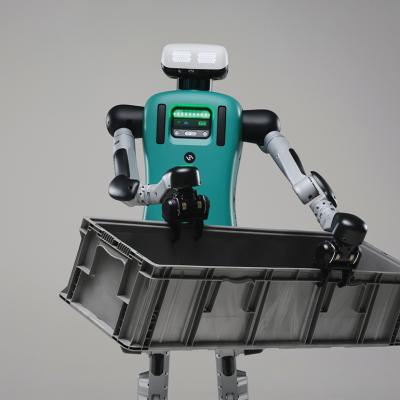Digit the robot carrying a black crate.