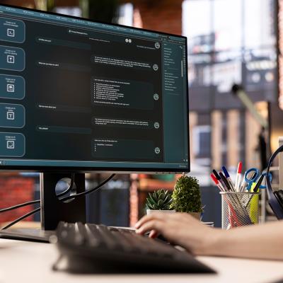 An employee using an online AI assistant application for automated tasks.