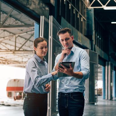 Warehouse managers checking logistic systems at work.