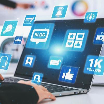 Blogging and engagement graphics illustrated over a laptop.