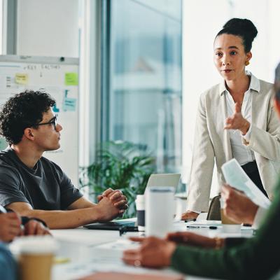 A businesswoman leading a marketing team's meeting.
