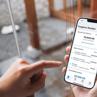 A user's phone displaying cash flow management app.