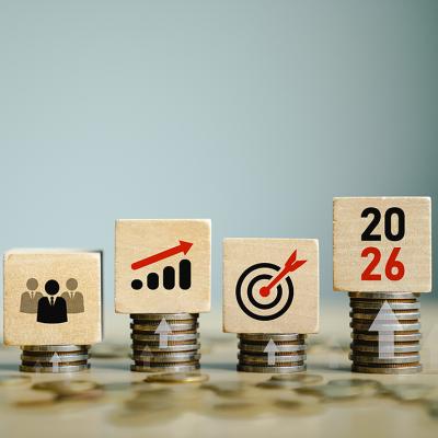 Wooden blockes with team forecast and 2026 growth goals graphics as a concept of economic forecast.