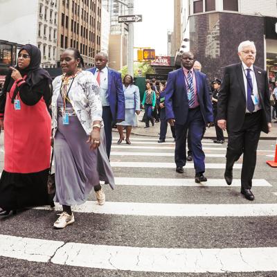 New Yorkers crossing the street to go to work in the morning.