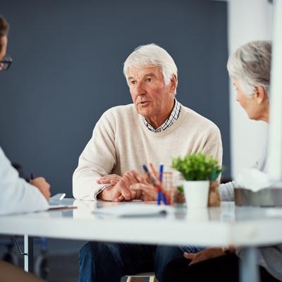 A senior couple consulting with a doctor for a health checkup. 