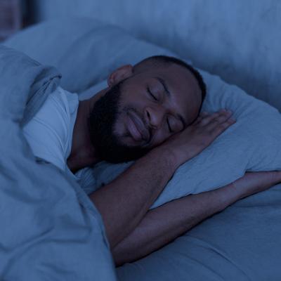 A person sleeping well in a bedroom.