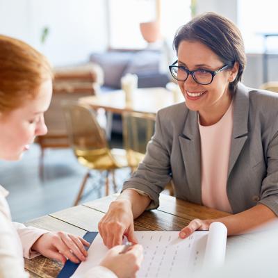 An employer discussing the terms of contract to an applicant.