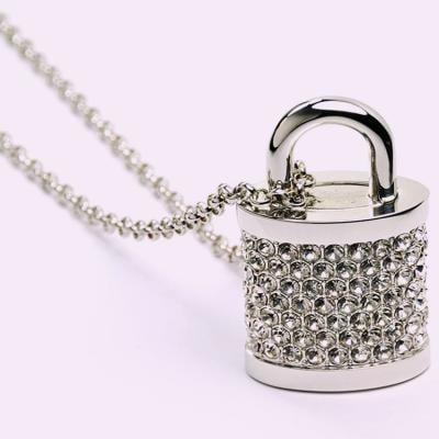 A bejeweled padlock with a string.