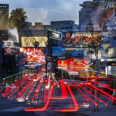 A slow exposure shot resulting in a mosaic of streaming car lights in a sea of billboards on Sunset Boulevard in West Hollywood.