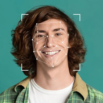 A young man illustrated with a face recognition graphic as a concept of deepfakes.