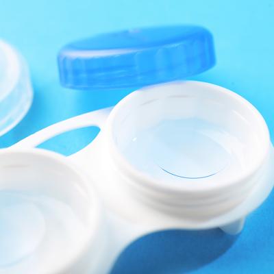 A contact lens case with contact lenses and soluton stored inside. 