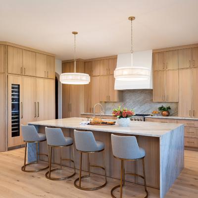 Contemporary kitchen with light wood flooring and cabinets.