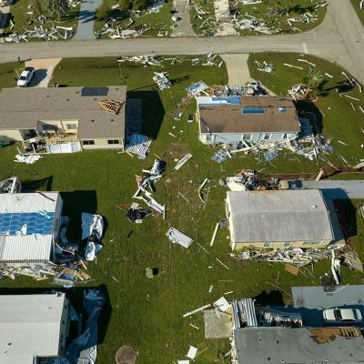 Aerial view of a residential area heavily damaged by hurricane Ian in Florida.