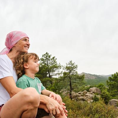 A cancer patient enjoying their time in nature with her child.