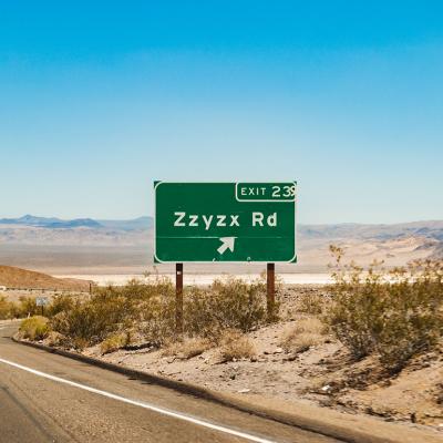 Zzyzx Rd sign at Interstate 15 freeway from Los Angeles, California to Las Vegas, Nevada in USA.