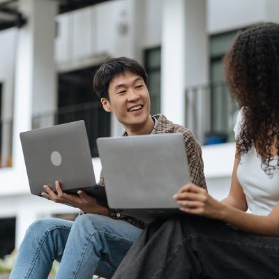 University students sharing conversations outdoors in the campus.