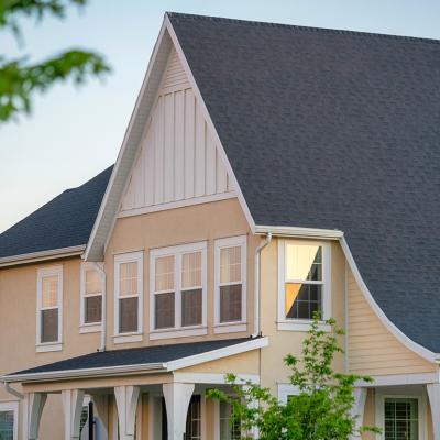 A two-story residential house with gray roofing.