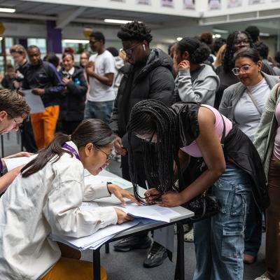 Students queue to get their GCSE results at City Of London Magistrates Court on August 21, 2025 in London, England. 