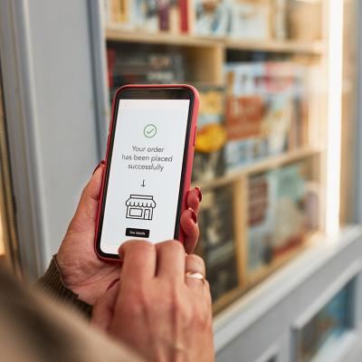 A person paying an online item through a mobile payment app in a smartphone.