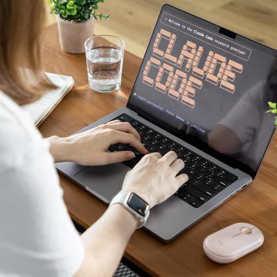 A person checking on Claude Code and its research review in a laptop.