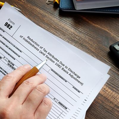 Person reviewing to sign a Form 982.