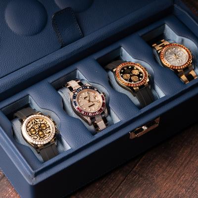 Four rolex watches in a luxury case.