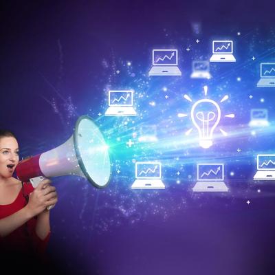 A young woman with a megaphone illustrated with shouting out business email graphics as a concept of marketing.