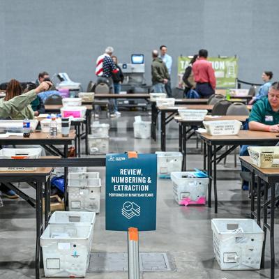 Election officials processing and counting official ballots during Election Day in Milwaukee, Wisconsin, USA.