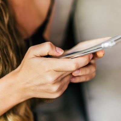 A woman texting on her phone.
