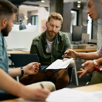 Freelance workers discussing a report.