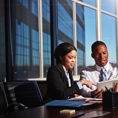 Business account managers collaborating for a revenue report and budget review in an office room.