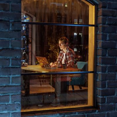 A view from the window of a female creative professional working late at night.