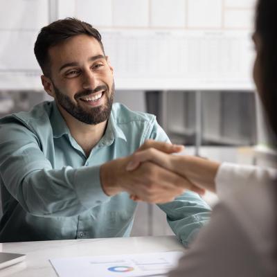 Business partners shaking hands after closing a business account deal.