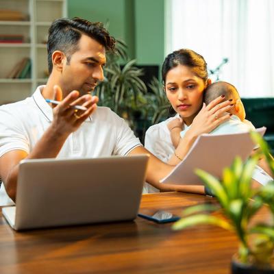 A married couple discussing about family matters and budget at home.