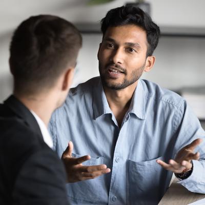 A young businessman consulting with a financial advisor.