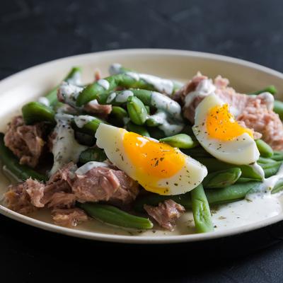 A tuna and green bean salad with boiled egg.