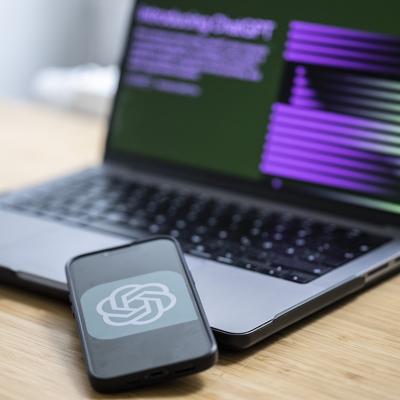 ChatGPT logo is displayed from a smartphone's screen.