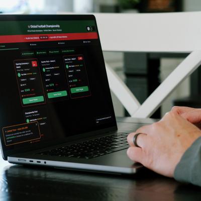 A person booking Soccer Tournament tickets online from a potential unofficial and scam ticket website.