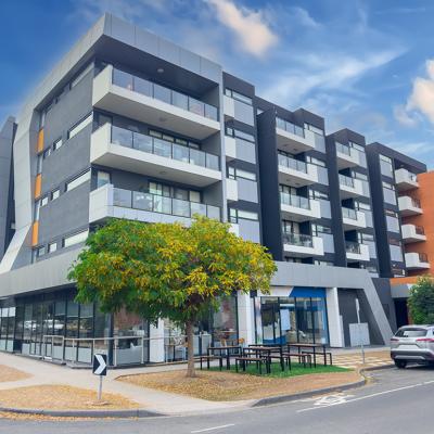 A multi-story residential apartment building situated in Melbourne, Australia.