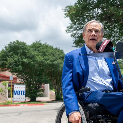 Texas Governor Greg Abbott speaks during a news conference after casting his vote during early voting of the primary runoff at the Austin Recreation Center on May 18, 2026 in Austin, Texas. 
