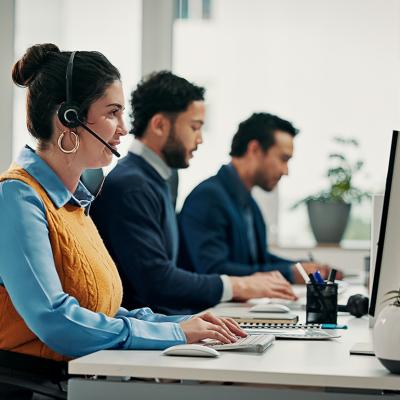 A call center employee talking with a customer over a call for solution support.