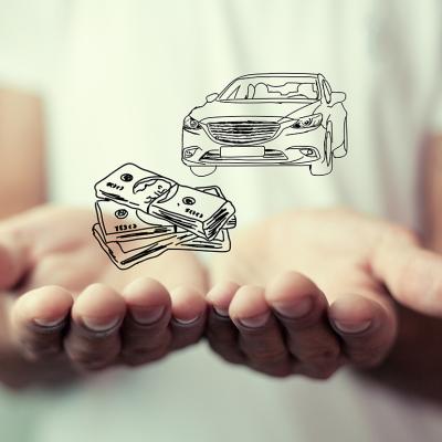 Person holding over an illustration of cars and money as a concept of insurance.