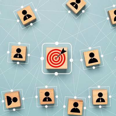 A red dartboard with human customer icons surrounding its connective map as a concept of customer target troup.