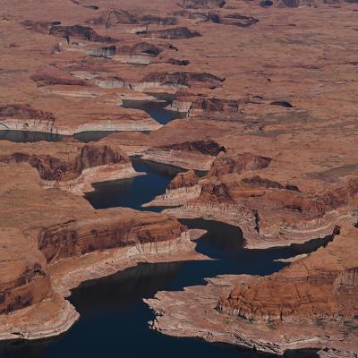 A bathtub ring marks the receded shoreline at Lake Powell, where water levels remain low in Glen Canyon National Recreation Area on April 30, 2026, near Big Water, Utah. 