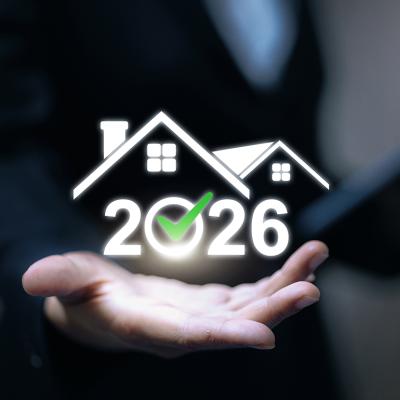 A real estate professional gesturing to hold a 2026 housing graphic illustration.