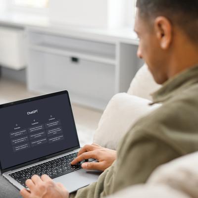 A male student using Chat GPT on a laptop.
