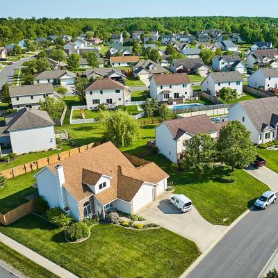 Aerial view of a residential area with two story houses.