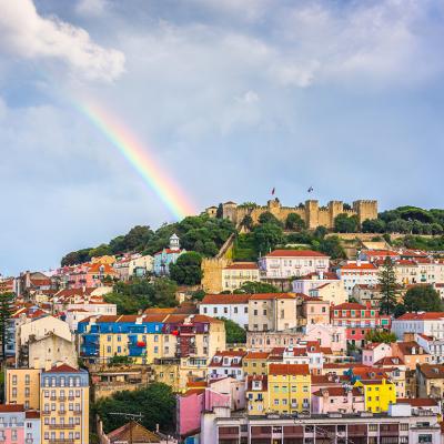 A rainbow seen over the Sao Jorge Castle and Lisbon skyline in Portugal.